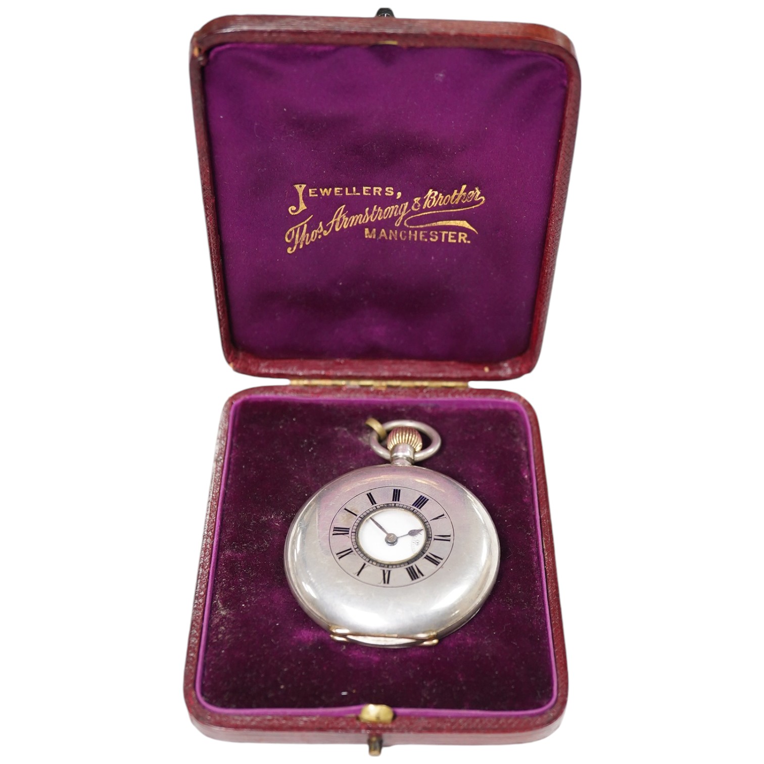 A Swiss 935 white metal half hunter pocket watch, in leather case. Condition - poor to fair